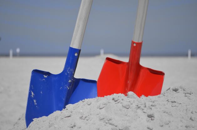 two shovels at the beach