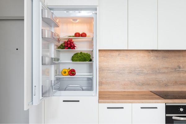 open fridge with vegetables separated